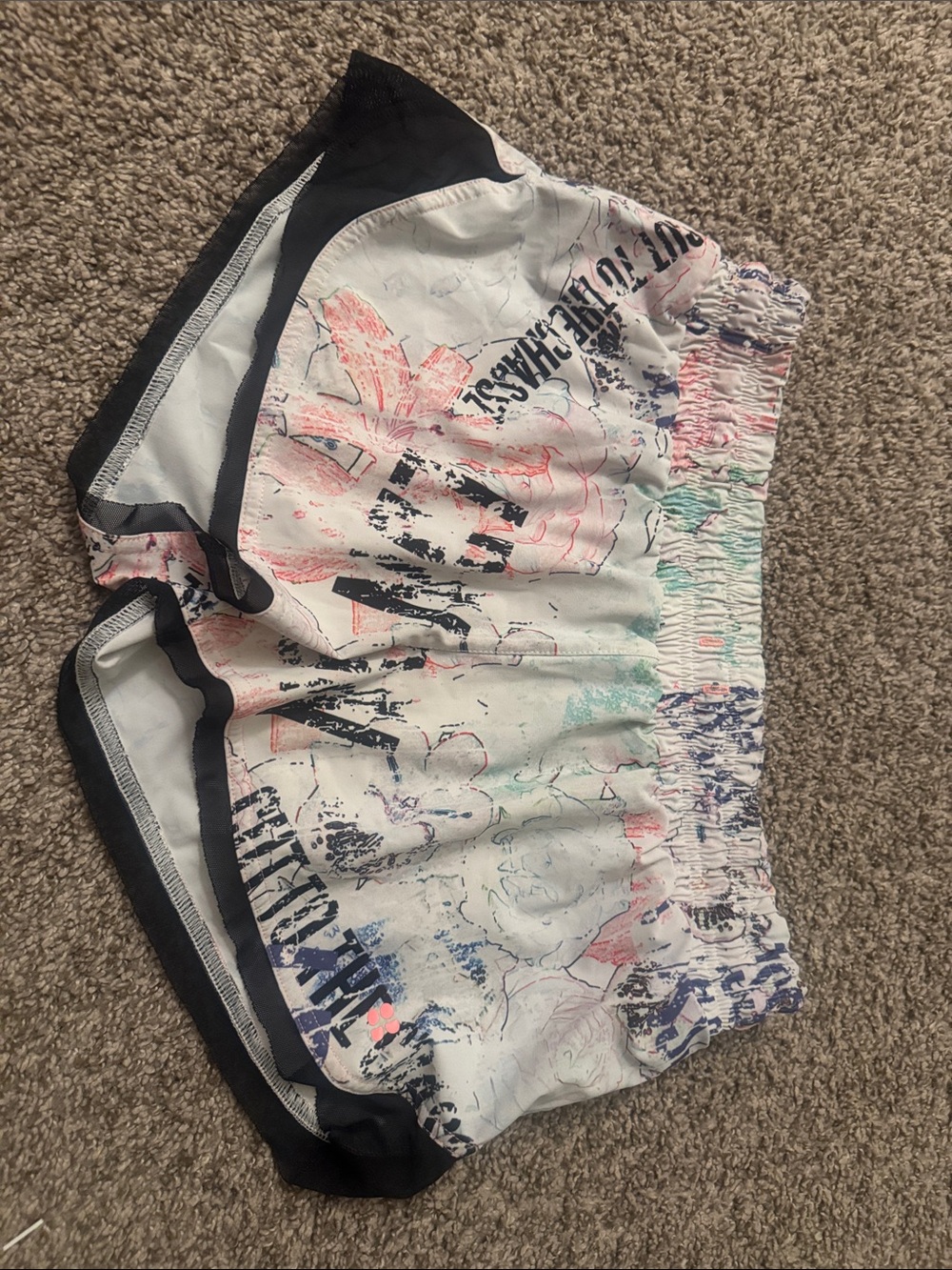 Sweaty Betty White Floral Graphic Athletic Shorts with Black Trim